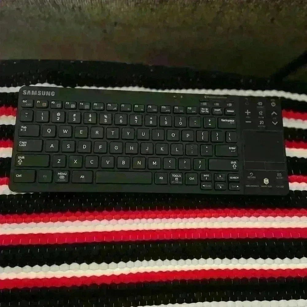 Samsung Bluetooth Keyboard with remote functionality & track pad. 2AA batteries
